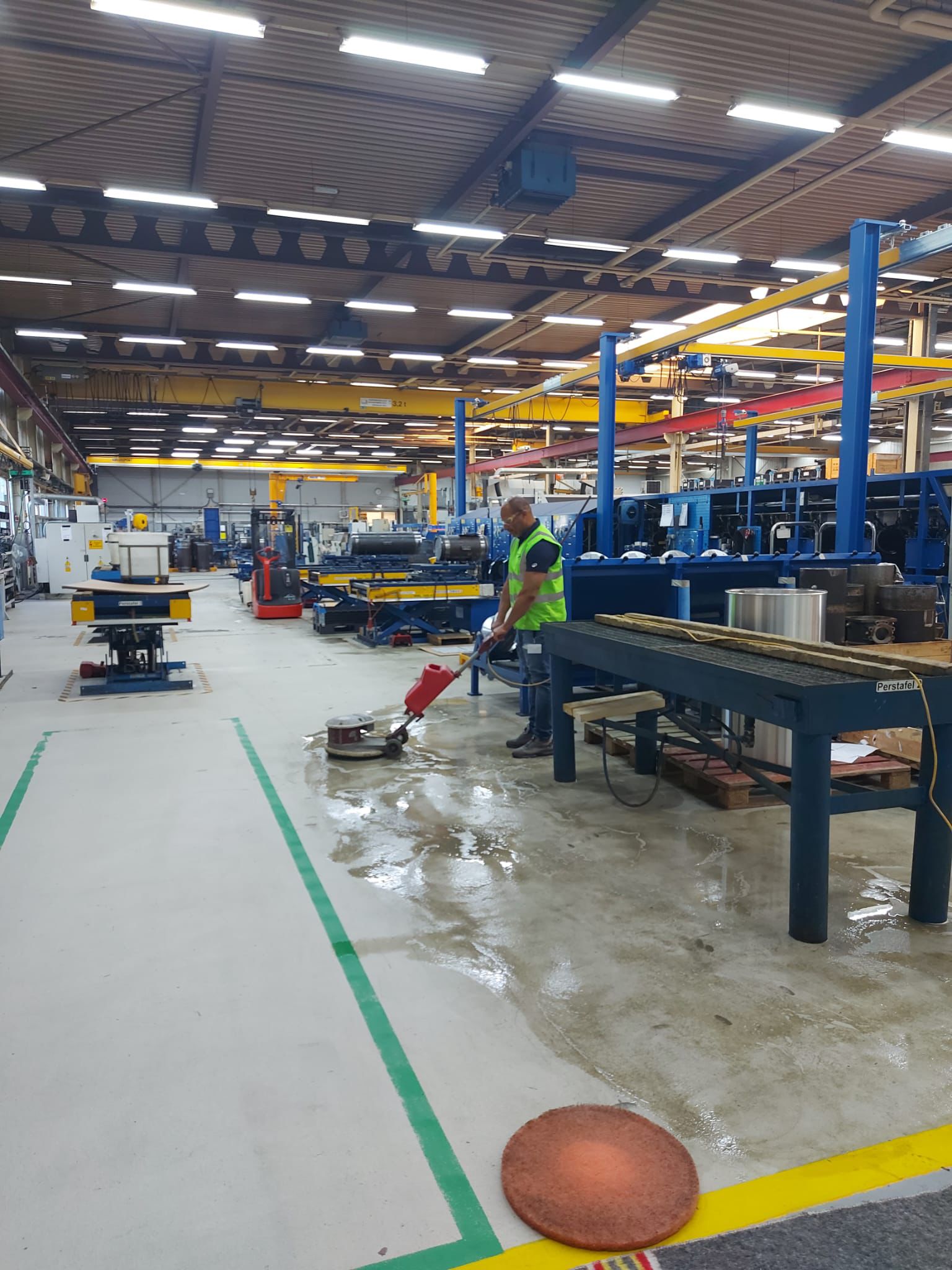 Industrial floor cleaning with a scrubber by Emerson Cleaning Solutions